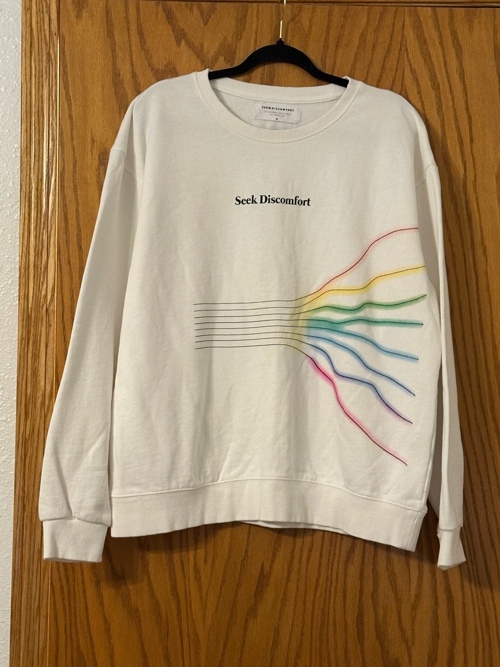 Seek Discomfort Women's Cream Graphic Sweatshirt with Rainbow Detail - Size XL
